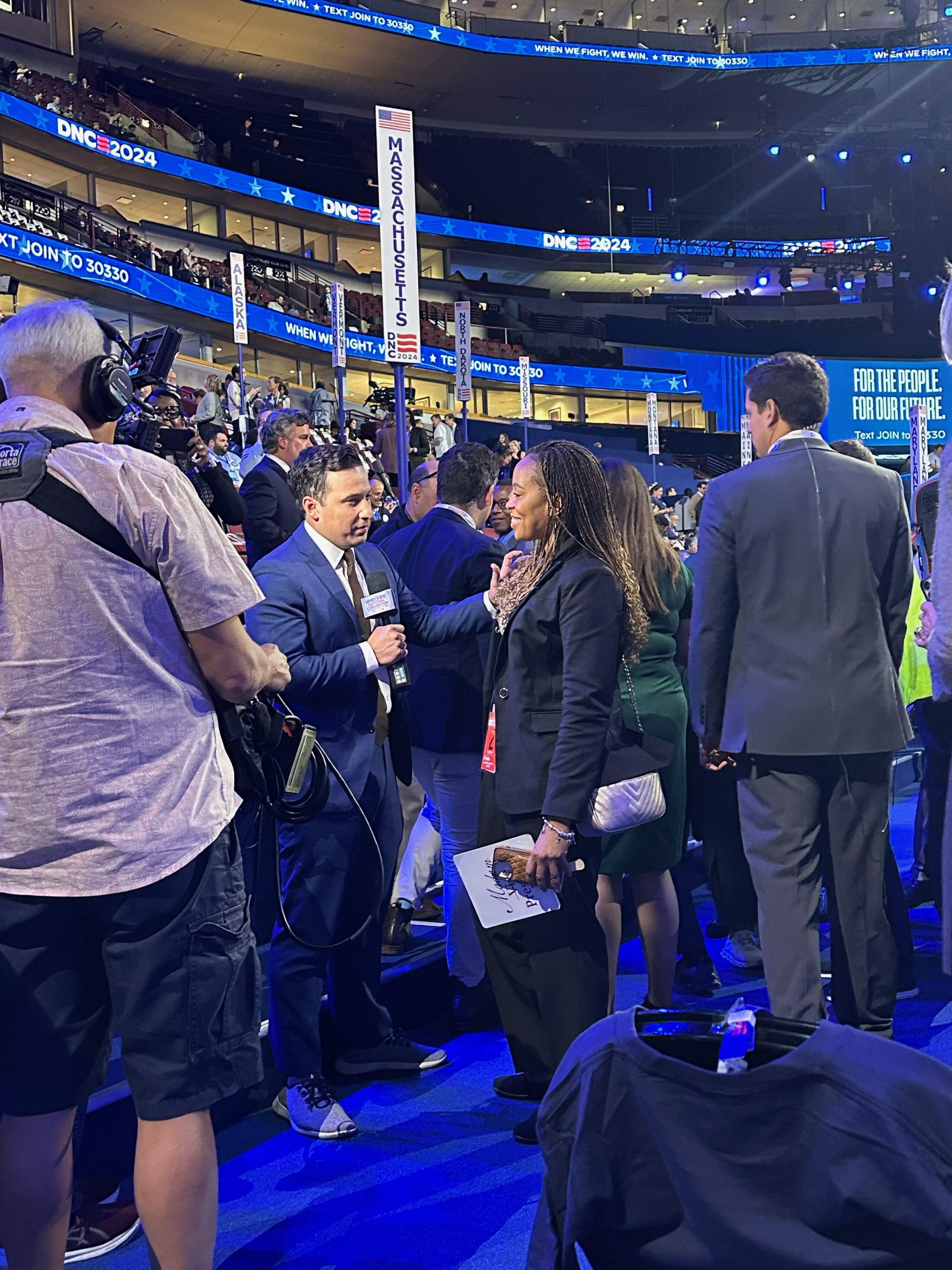 ABC News multi-platform reporter Jay O'Brien interviews someone on the convention floor. (Courtesy Kaivan Shroff)