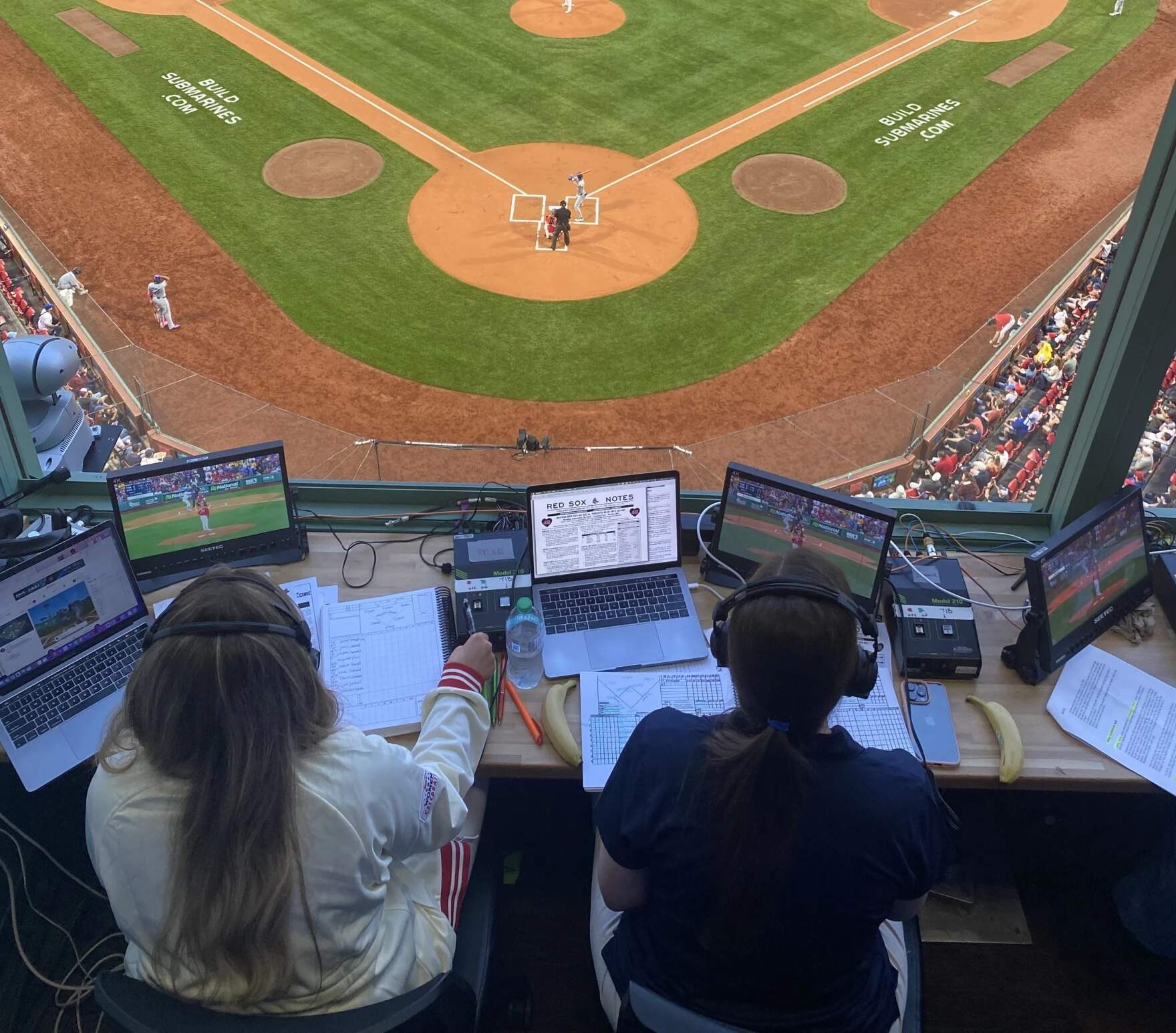 Portland Sea Dogs broadcasters Rylee Pay, left, and Emma Tiedemann, right, joined the NESN booth on Monday, August 26, 2024 to call several innings of the Boston Red Sox game at Fenway Park. (Courtesy of Emma Tiedemann)