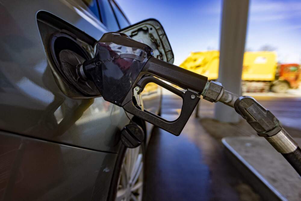 An automobile being filled with gas at a gas station. (Jesse Costa/WBUR)