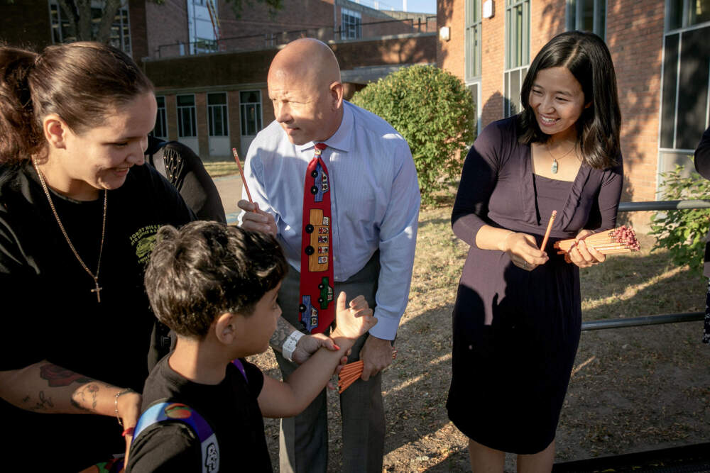 Mayor Michelle Wu greets students arriving at the Joseph Lee School in Dorchester on Thursday, Sept. 4. (Robin Lubbock/WBUR)