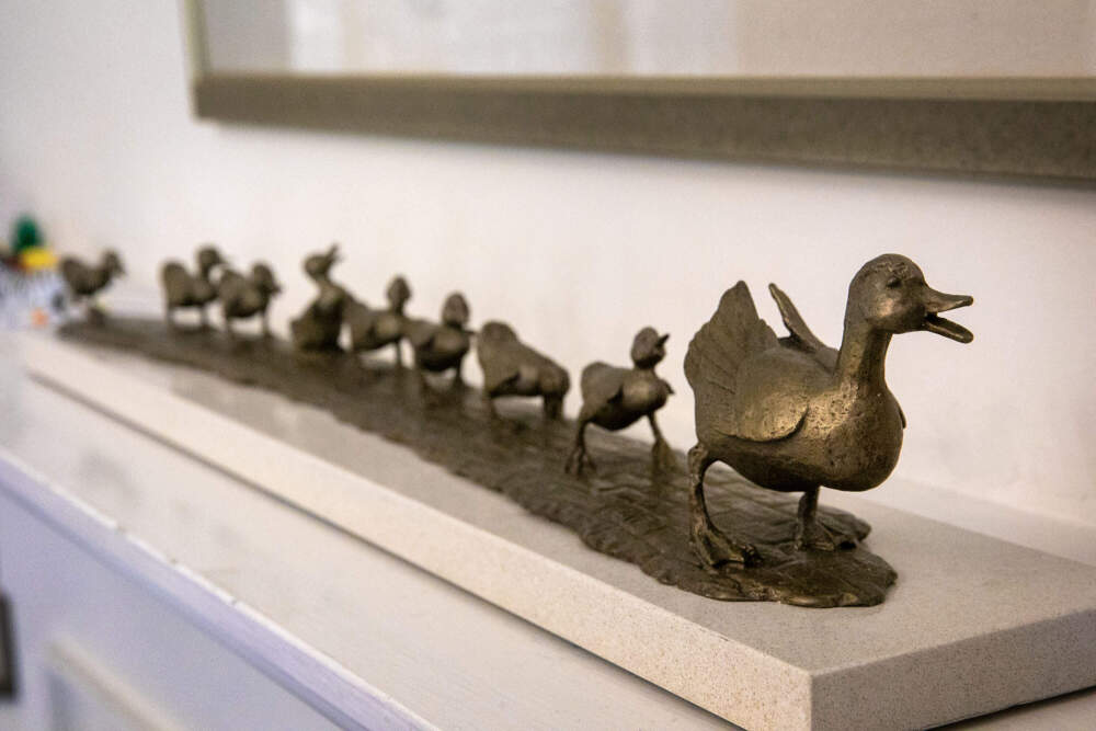 A maquette of 'Make Way for Ducklings' walks over a fireplace at sculptor Nancy Schön's home. (Robin Lubbock/WBUR)