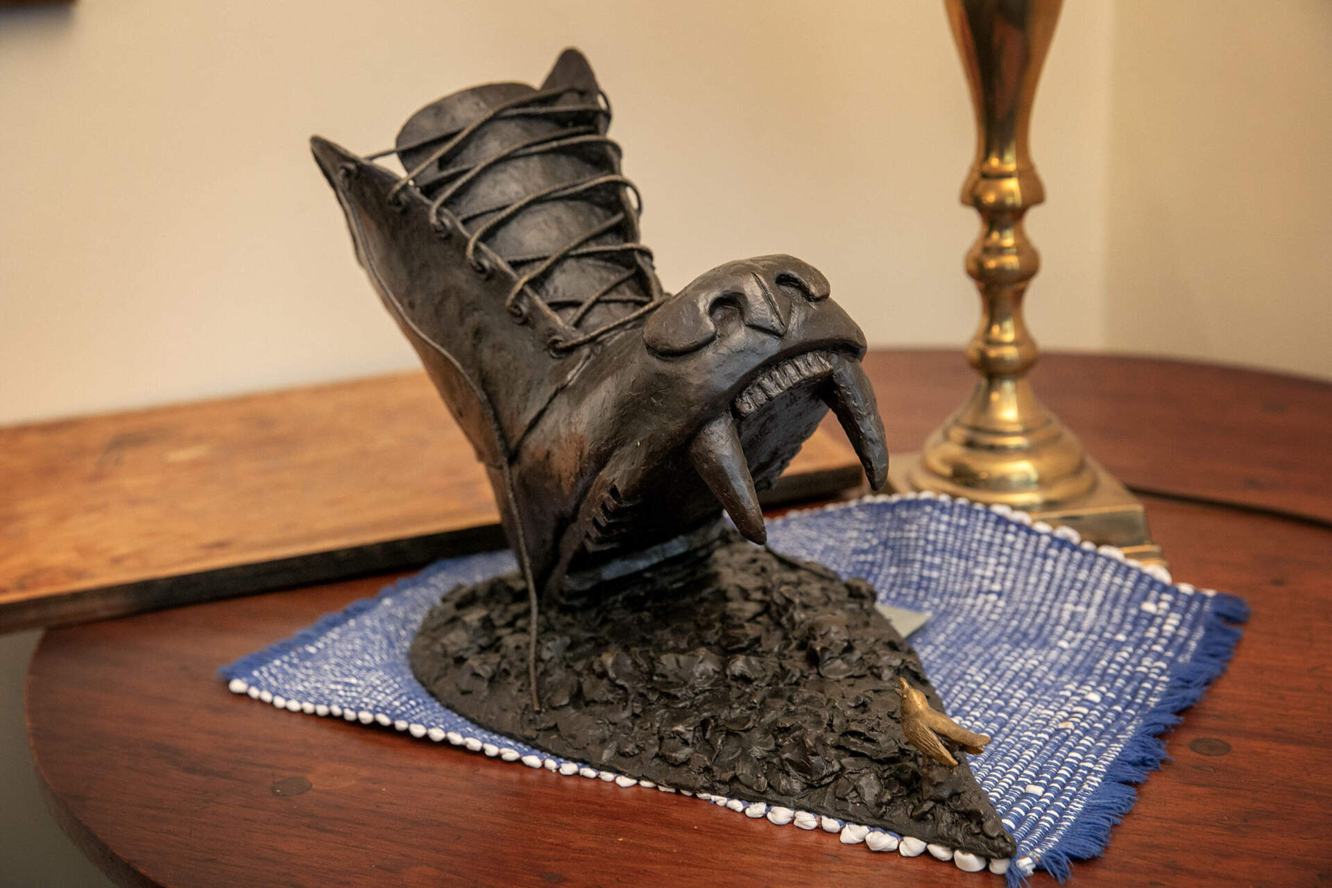 A recent sculpture by Nancy Schön has a fanged Russian boot attempting to crush a nightingale. (Robin Lubbock/WBUR)