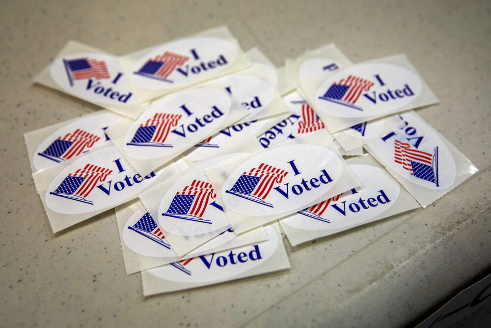 Stickers awaiting voters in Dorchester, in 2023. (Robin Lubbock/WBUR)