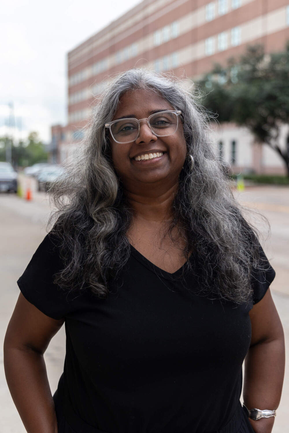 Krish Gundu and her colleagues are stopping people who’ve spent the night in the jail’s processing center as they walk out the door. (Lucio Vasquez/Here & Now)