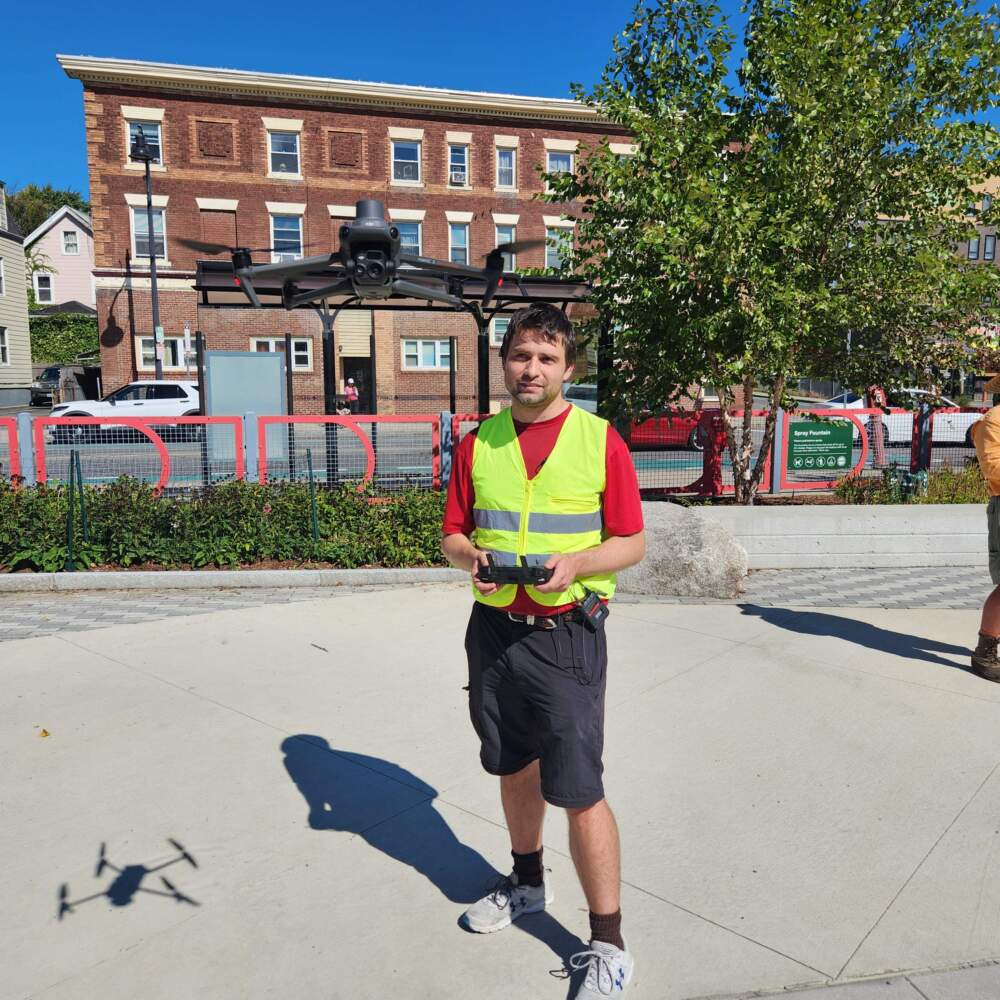 Unmanned Aircraft Systems pilot equipment technician and drone class instructor at Umass Amherst, Ryan Wicks, flies a drone at Conway Park in Somerville. He is part of a team collecting video of traffic on a stretch of Beacon Street to assess the risk of crashes between cars and bicycles. Andrea Perdomo Hernandez/WBUR