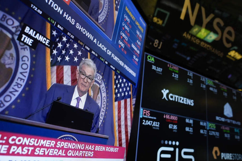 A news conference with Federal Reserve Chair Jerome Powell appears on a monitor on the floor at the New York Stock Exchange. (Seth Wenig/AP)