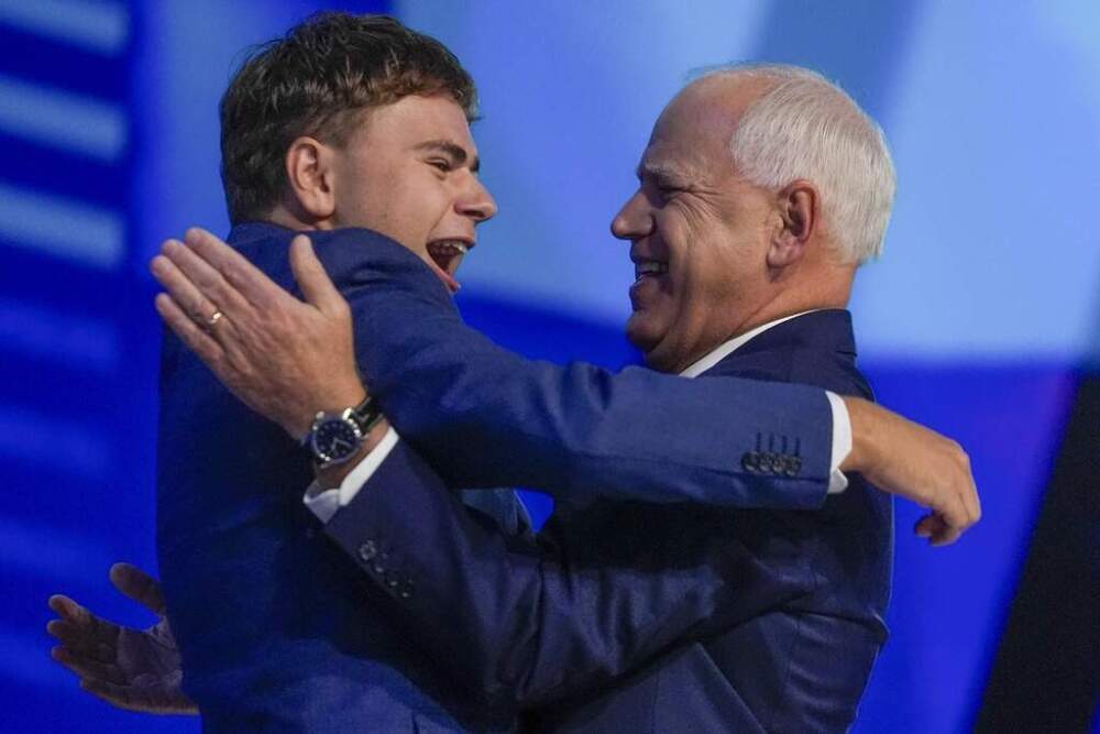 Democratic vice presidential nominee Minnesota Gov. Tim Walz hugs his son Gus during the Democratic National Convention Wednesday, Aug. 21 in Chicago. (Erin Hooley/AP)