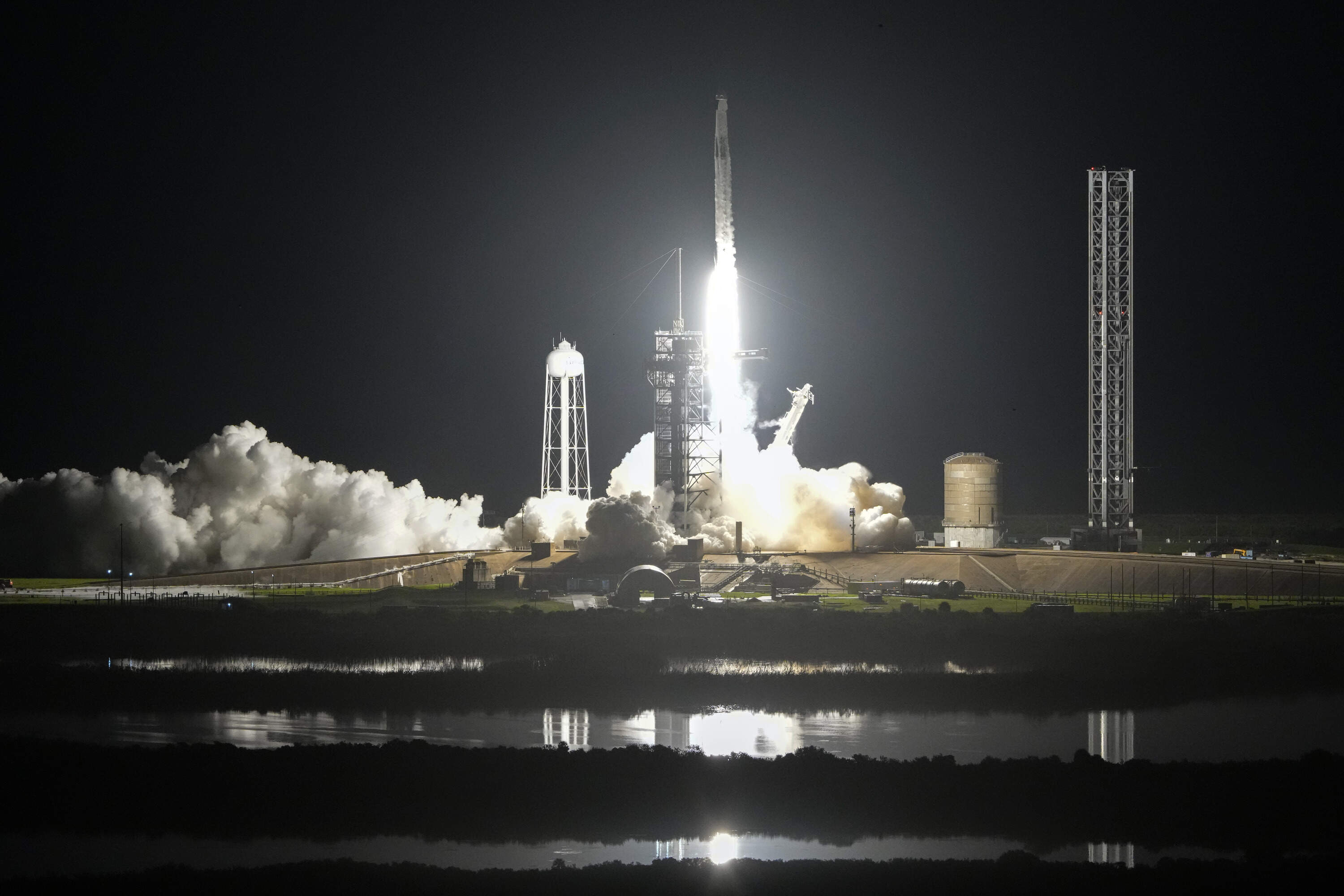 A SpaceX Falcon 9 rocket with a crew of four lifts off from pad 39A at the Kennedy Space Center in Cape Canaveral, Florida. (John Raoux/AP)