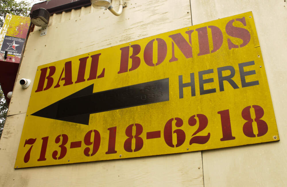 A sign advertises bail bonds outside Mario Garza's office. (Wilder Fleming/Here & Now)