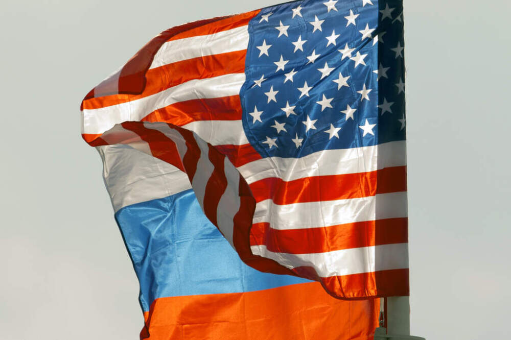 U.S. and Russian national flags wave on the wind in Moscow's Vnukovo airport, Russia, April 11, 2017 to welcome a U.S. dignitary. (AP Photo/ Ivan Sekretarev, file)