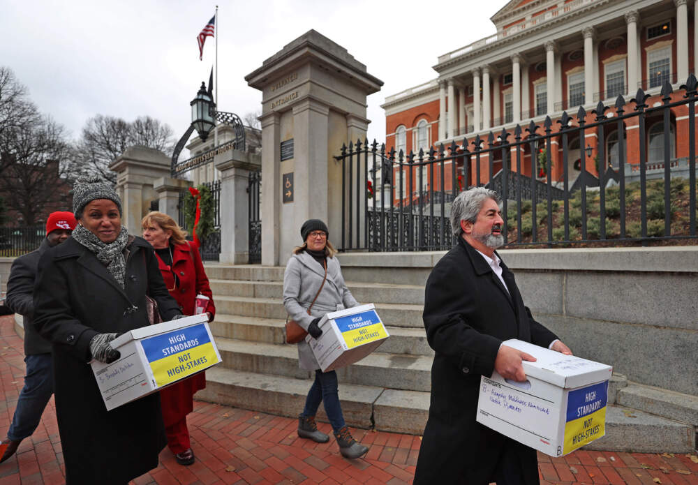 The Massachusetts Teachers Association delivered 135,000 signatures last fall in support of their ballot question to remove the high school graduation requirement tied to MCAS testing. (David L. Ryan/The Boston Globe via Getty Images)