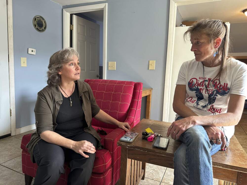 Heidi Wright, right, who is experiencing homelessness and must leave her state-funded motel room by Sept. 28, 2024, talks to Jen Armbrister, an outreach case manager for the Good Samaritan Haven in Barre, Vt.. (Lisa Rathke/AP)