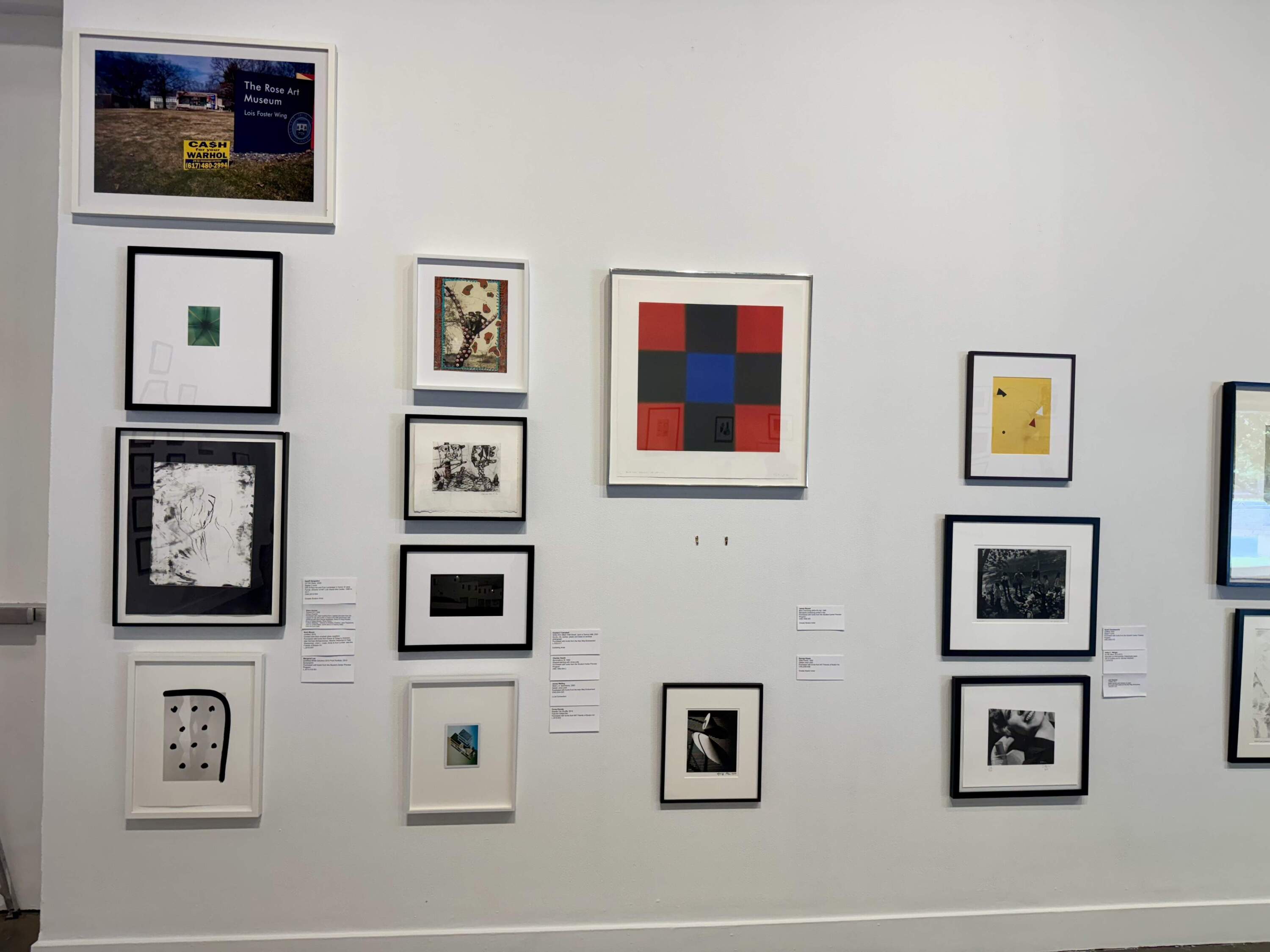 A wall at MIT’s List Visual Arts Center where students already removed work to take home. (By Maddie Browning)
