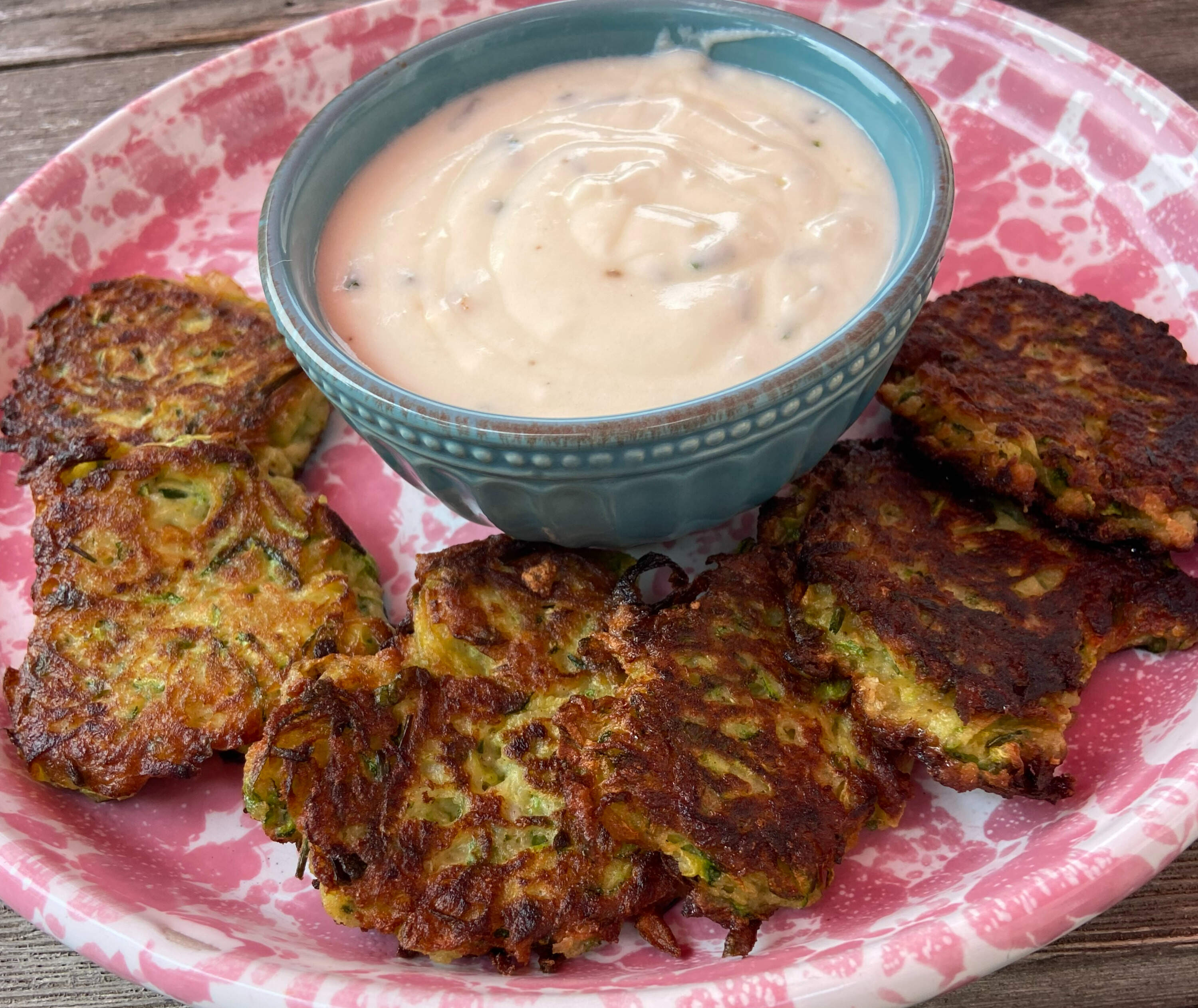 Roasted garlic and zucchini fritters with roasted garlic yogurt sauce. (Kathy Gunst/Here &amp; Now)