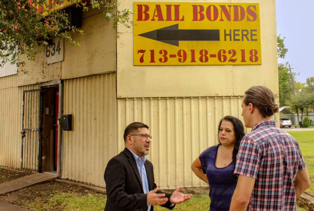 Mario Garza, Michelle Chappa and Peter O’Dowd stand outside 1st Advantage Bail Bonds in Houston, Texas. (Wilder Fleming/Here & Now)