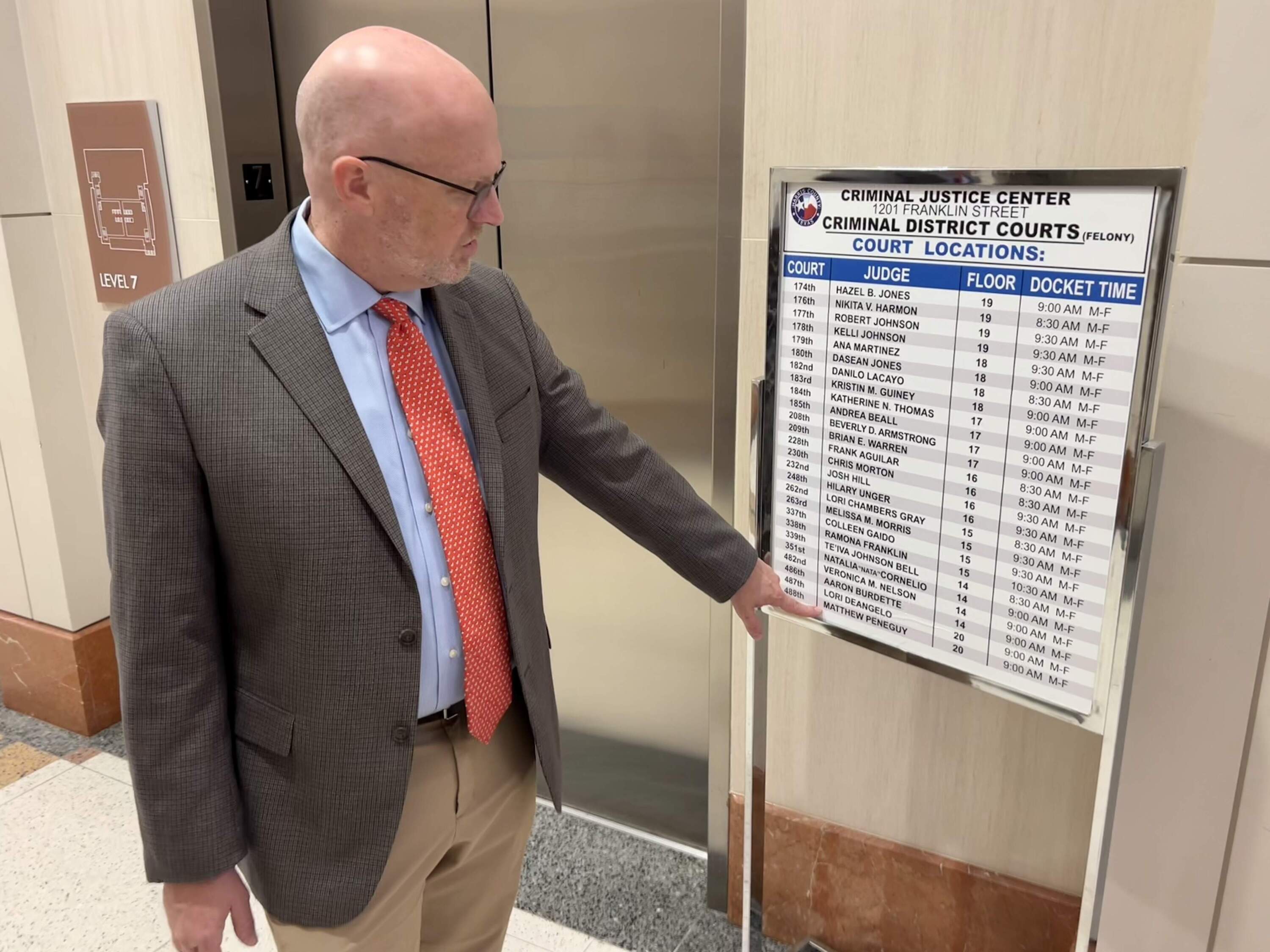 Defense attorney Murray Newman inside Harris County Criminal Justice Center that towers over downtown Houston. “It’s chaos,” he says. (Peter O’Dowd/Here & Now)