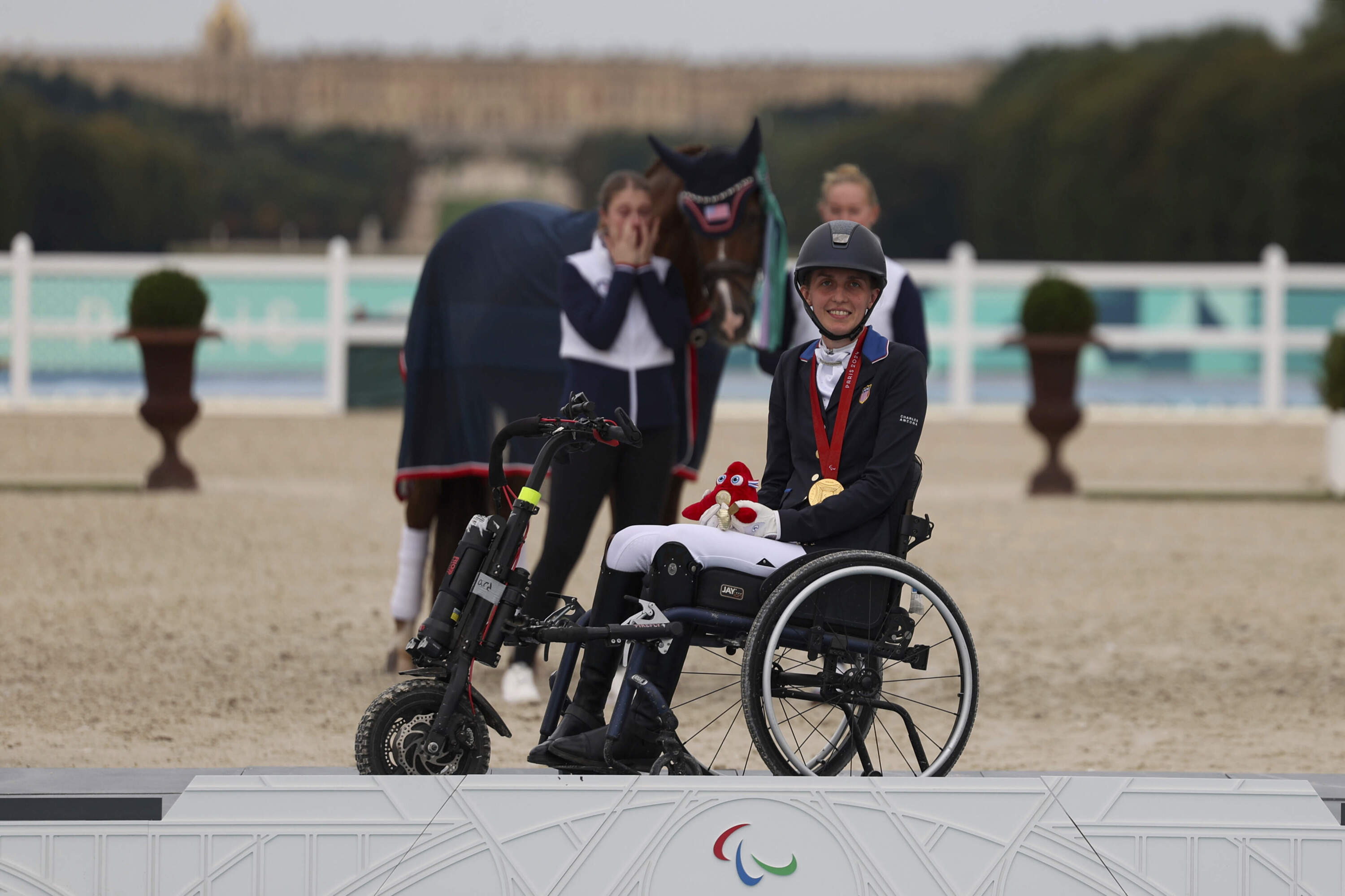 Fiona Howard of the U.S. celebrates after winning the equestrian grade II individual event at the Palace of Versailles, at the 2024 Paralympics, Tuesday, Sept. 3, 2024. (Kileigh Kane/AP)