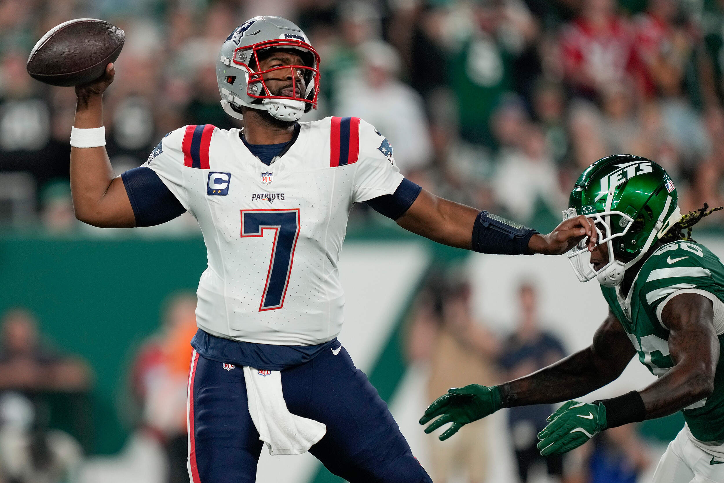 New England Patriots quarterback Jacoby Brissett (7) passes under pressure from the New York Jets. (Julia Demaree Nikhinson/AP)