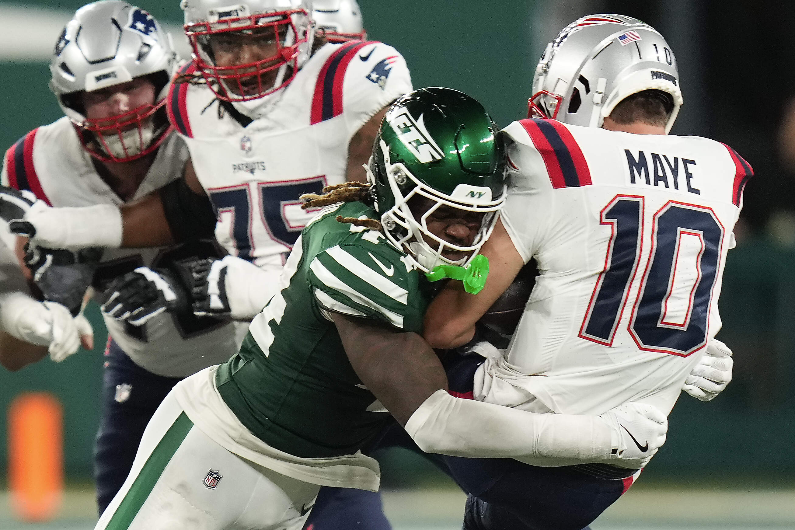 New York Jets linebacker Jamien Sherwood (44) sacks New England Patriots quarterback Drake Maye (10) during the fourth quarter of an NFL football game, Thursday, Sept. 19, 2024, in East Rutherford, N.J. (Seth Wenig/AP)