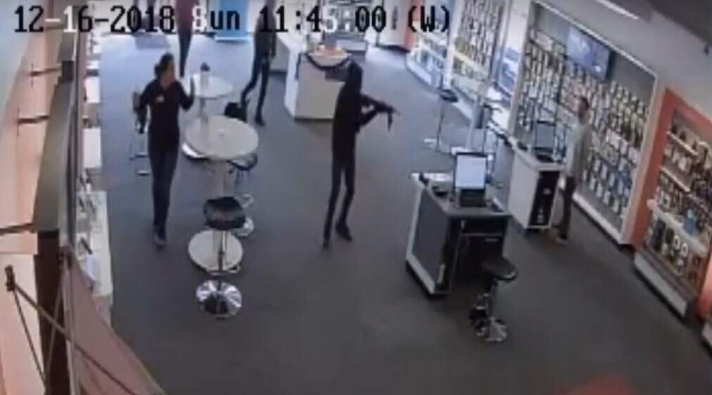 Security camera footage shows the armed robbery at the store Michelle Chapa managed. (Courtesy)