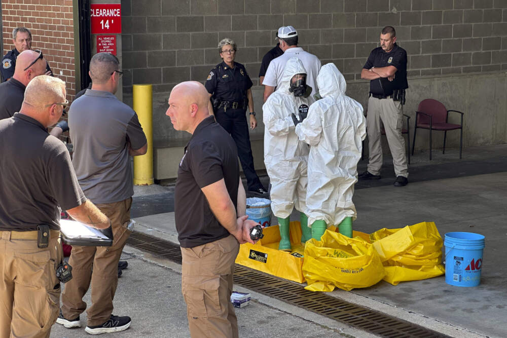 A hazmat crew from the National Guard's Civilian Support Team investigates after a suspicious package was delivered to election officials at the Missouri Secretary of State's Jefferson City, Mo., office on Tuesday Sept. 17, 2024. (Summer Ballentine/AP)