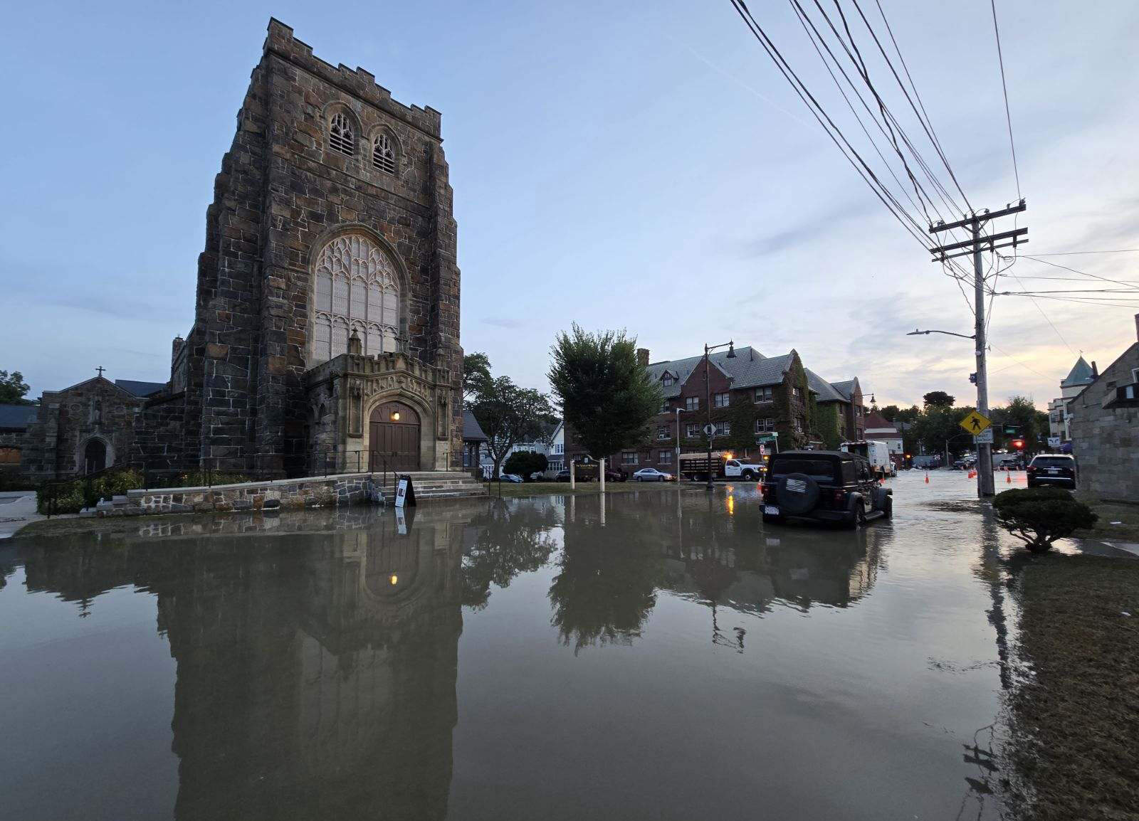 The water settles in Peabody Square after water stops flowing from the broken main. (Dorchester Reporter)