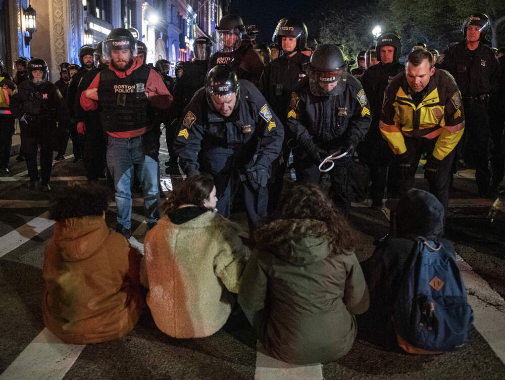 Police arrest pro-Palestinian supporters who blocked a road in Boston after officers cleared an Emerson College student protest camp at Boylston Place last April. (Joseph Prezioso / AFP via Getty Images)