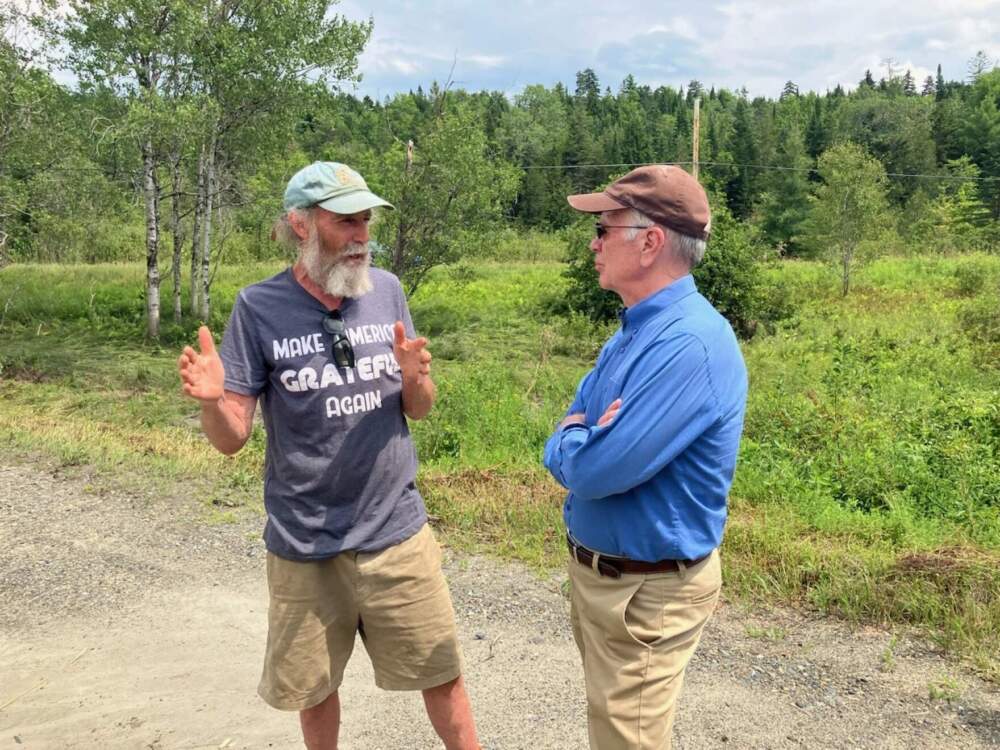 Sen. Peter Welch, right, talks with Bruce Kaufman, owner of Riverside Farms, which experienced severe crop losses during the summer floods of 2023 and 2024. (Peter Hirschfeld/Vermont Public)