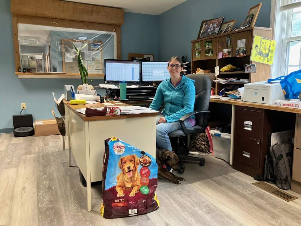 Barton Town Clerk Kristin Atwood, seen here at the town office with her dog, says she's spent hundreds of hours, outside regular office hours, trying to navigate FEMA's public assistance process. (Peter Hirschfeld/Vermont Public)