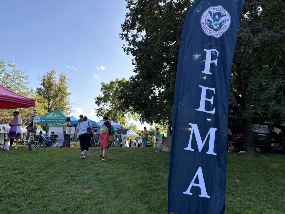 Representatives from the Federal Emergency Management Agency visit the Richmond Farmers Market to assist with flood recovery on Aug. 30, 2024. (April McCullum/Vermont Public)