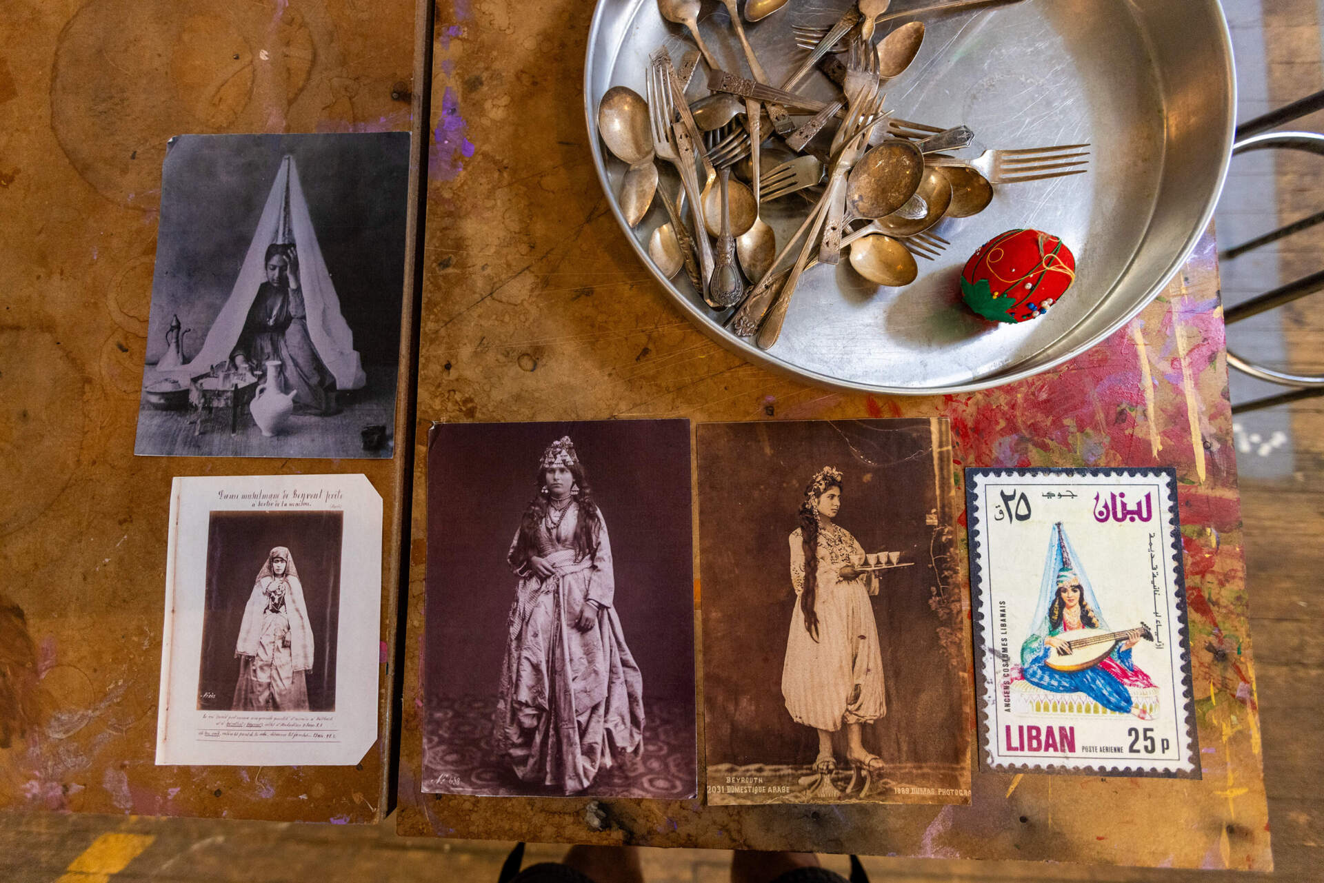 Photos of 19th-century Lebanese women used as inspiration for Feda Eid's work. (Jesse Costa/WBUR)