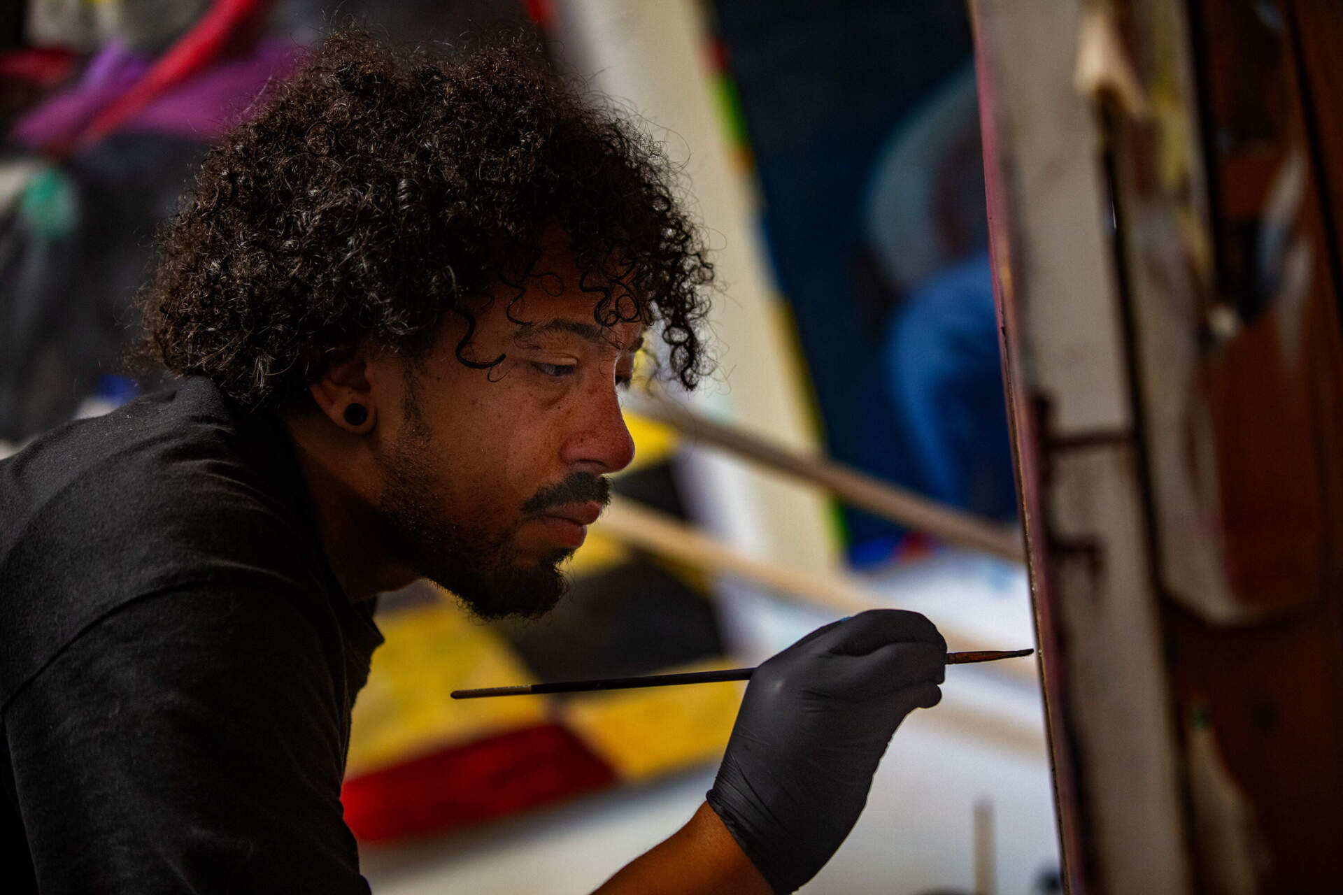 Jameel Radcliffe works in his studio at the Boston Center for the Arts in the South End. (Jesse Costa/WBUR)