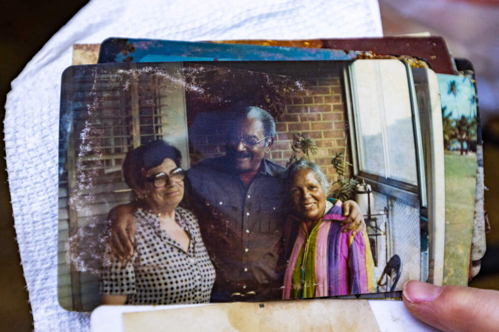 A photo Christine Berlane found in the rubble of the home of Hampton and Marguerite Gill, who is pictured on the far right. (Jesse Costa/WBUR)