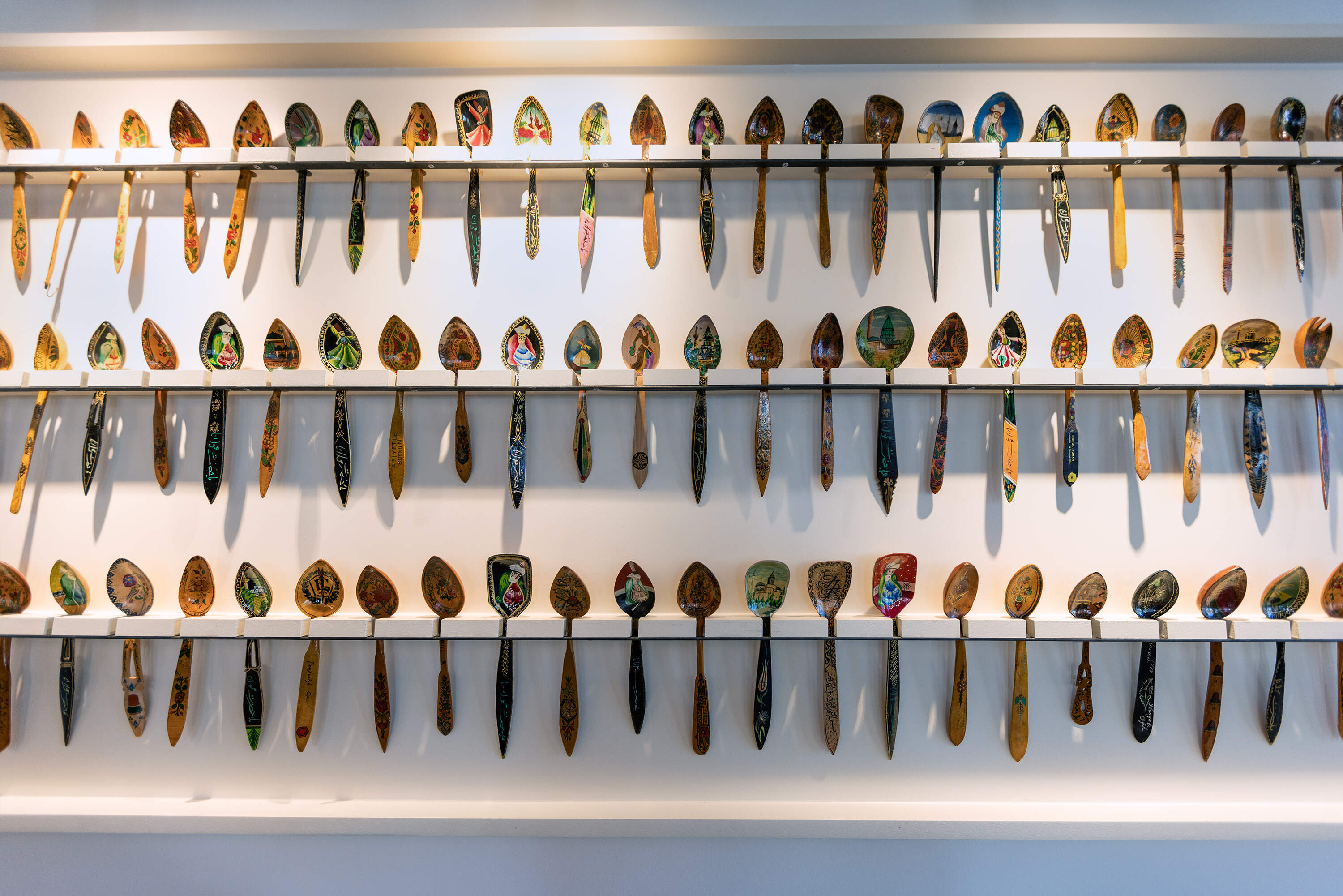 Decorative spoon display in the dining area at the new Sofra location in Allston. (Jesse Costa/WBUR)