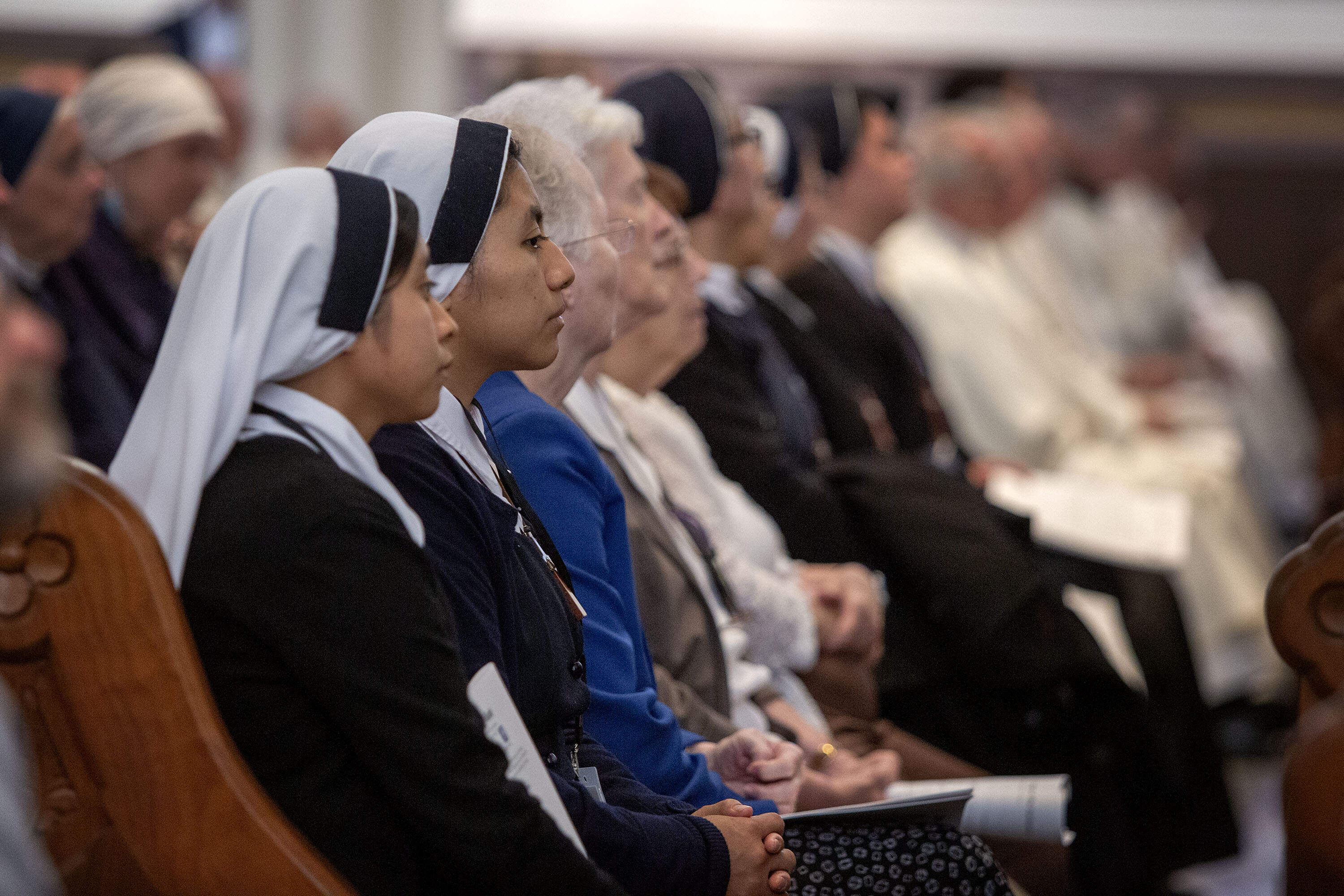 Nuns listen to Archbishop Richard Henning at his installation Mass. (Robin Lubbock/WBUR)