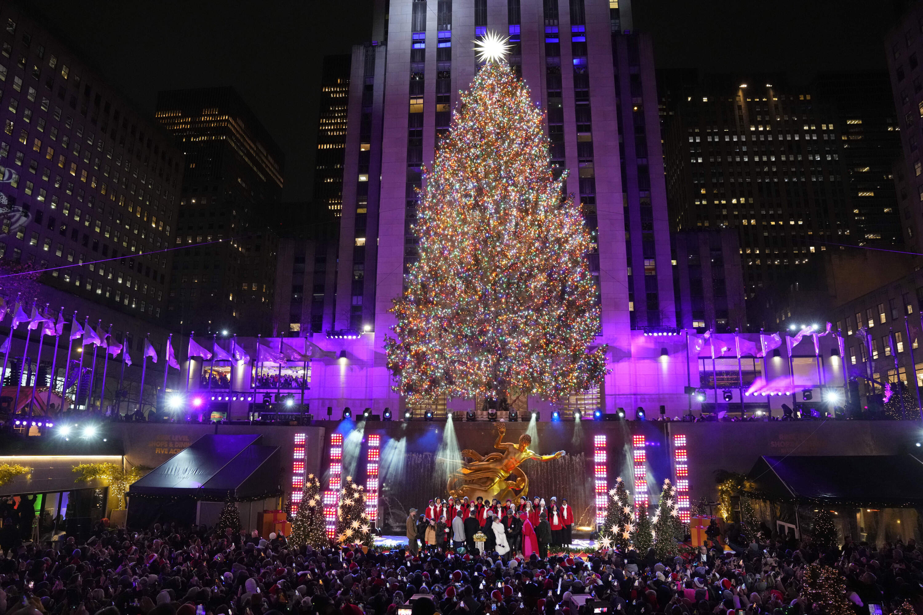 The 2023 Rockefeller Center Christmas tree is lit up in New York. (Charles Sykes/Invision/AP)