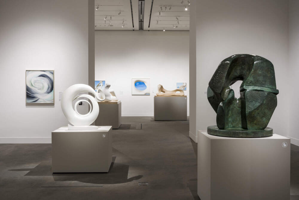Left to right: Georgia O’Keeffe, Abstraction White Rose, 1927. Oil on canvas. Georgia O’Keeffe Museum, Gift of the Burnett Foundation and the Georgia O’Keeffe Foundation. 1997.04.02; Georgia O’Keeffe, Abstraction, 1946, cast 1979–80. White lacquered bronze. Georgia O’Keeffe Museum, Gift of The Georgia O’Keeffe Foundation; Henry Moore, Working Model for Locking Piece, 1962. Bronze. The Henry Moore Foundation: gift of the artist 1977 LH 514. All O’Keeffe works © 2024 Georgia O’Keeffe Museum / Artist Rights Society (ARS), New York unless otherwise noted.