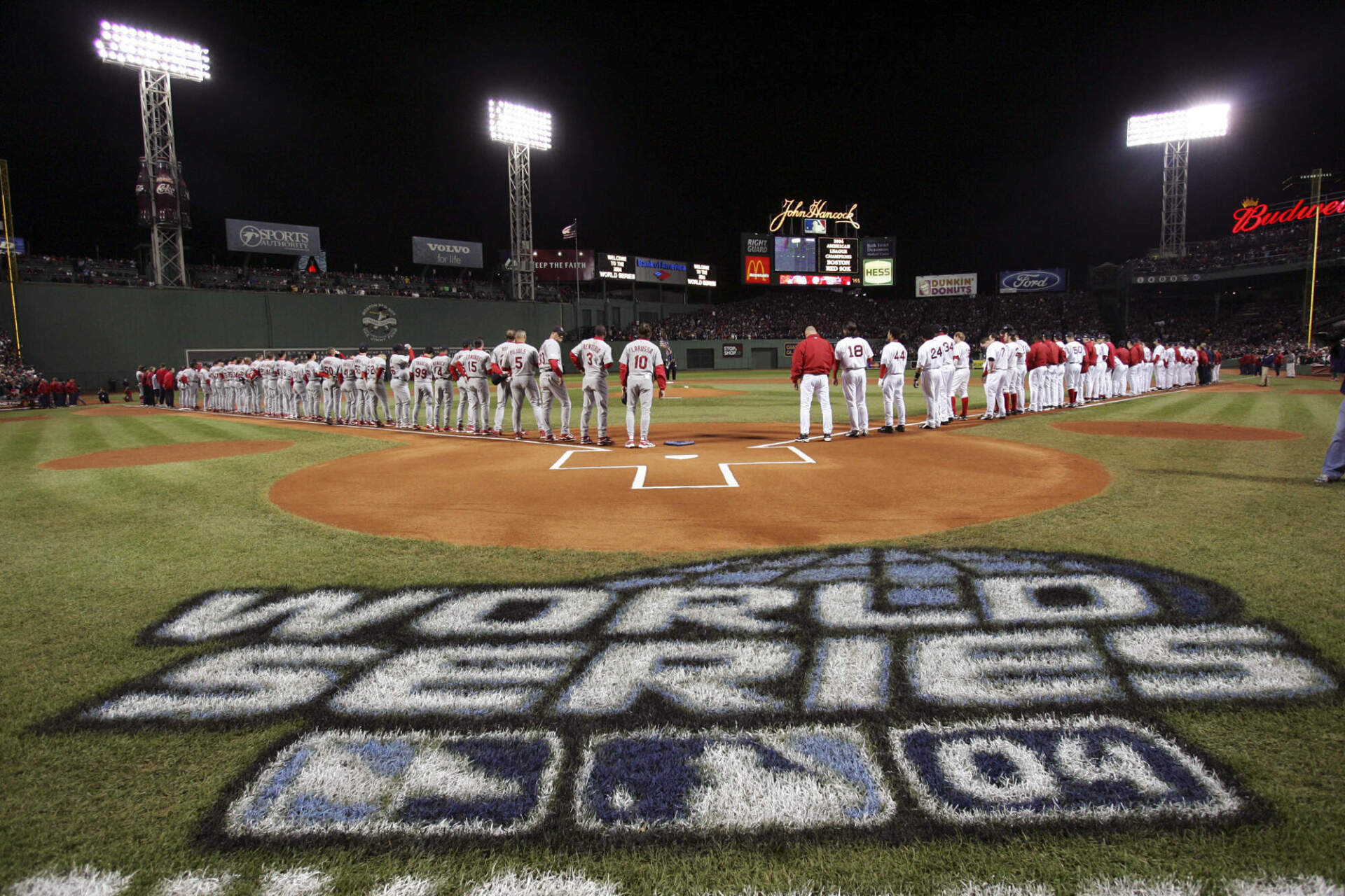 The St. Louis Cardinals, left, and the Boston Red Sox line up before the start of Game 1 of the World Series Saturday, Oct. 23, 2004 in Boston. (Mike Segar/AP)