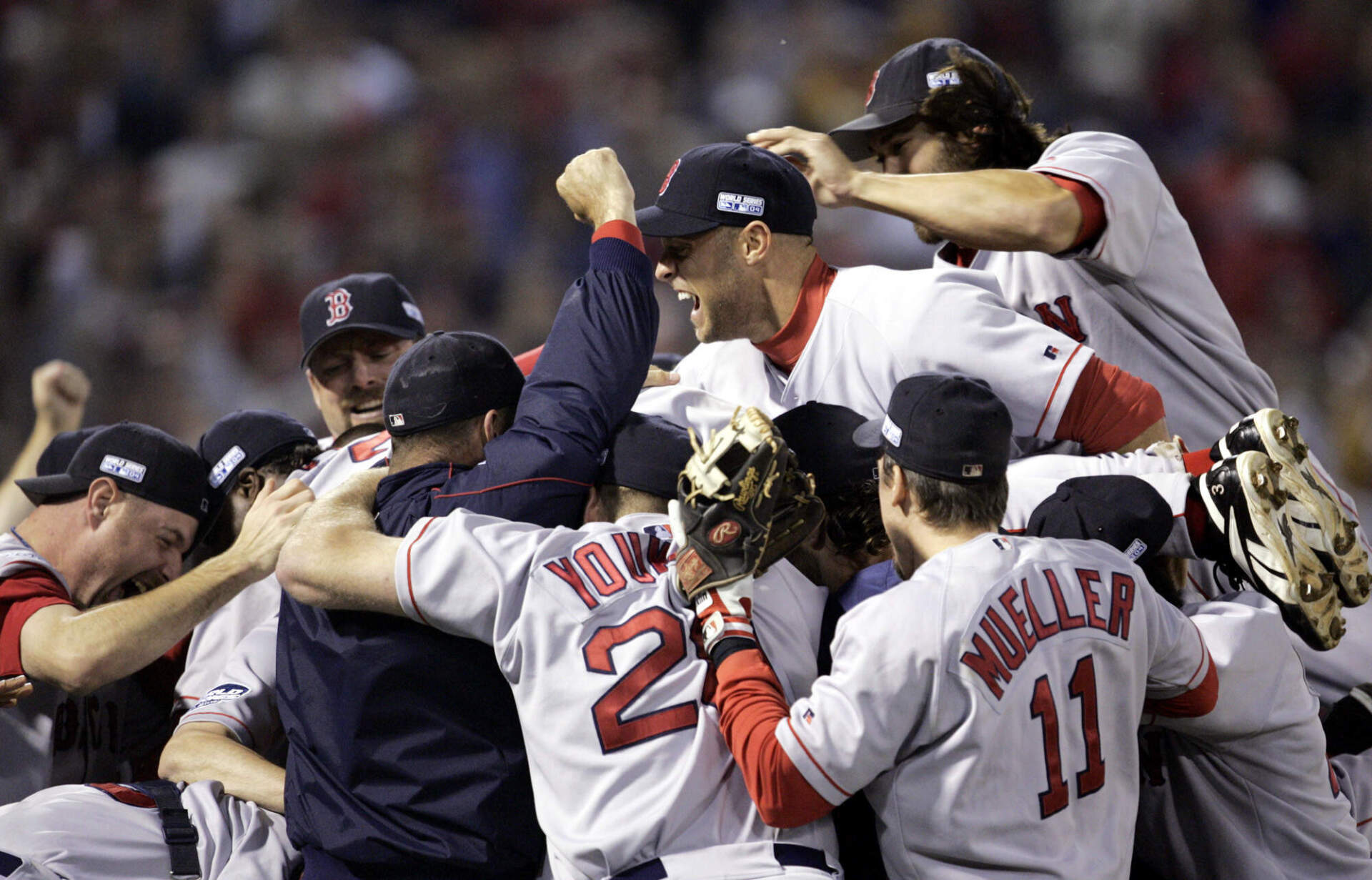 Boston Red Sox players celebrate after beating the St. Louis Cardinals 3-0 in Game 4 to win the World Series Wednesday, Oct. 27, 2004, in St. Louis. (Al Behrman/AP)