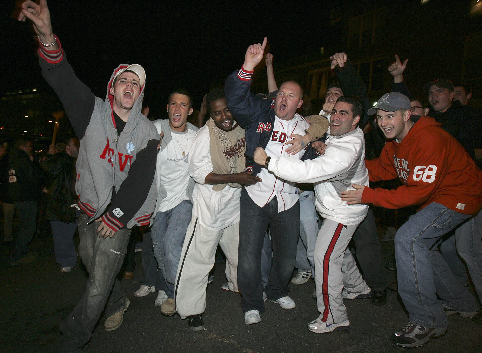 Boston Red Sox fans celebrate outside Fenway Park in Boston after the Red Sox beat the St. Louis Cardinals to win the World Series Wednesday, Oct. 27, 2004. (Michael Dwyer/AP)