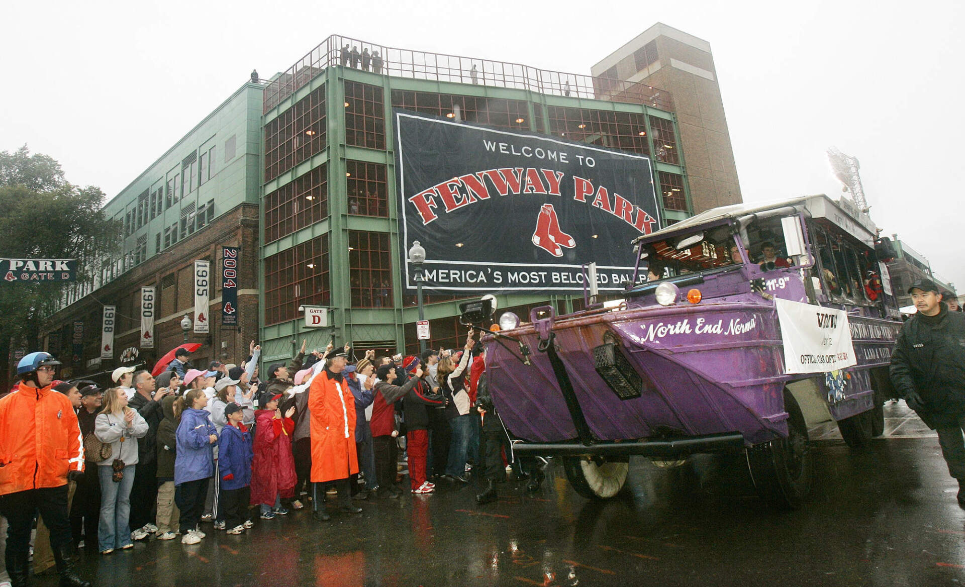 A duckboat carrying Boston Red Sox players and staff makes its way past Fenway Park during the rolling rally in Boston Saturday, Oct. 30, 2004, to celebrate the Red Sox World Series victory. (Elise Amendola/AP)