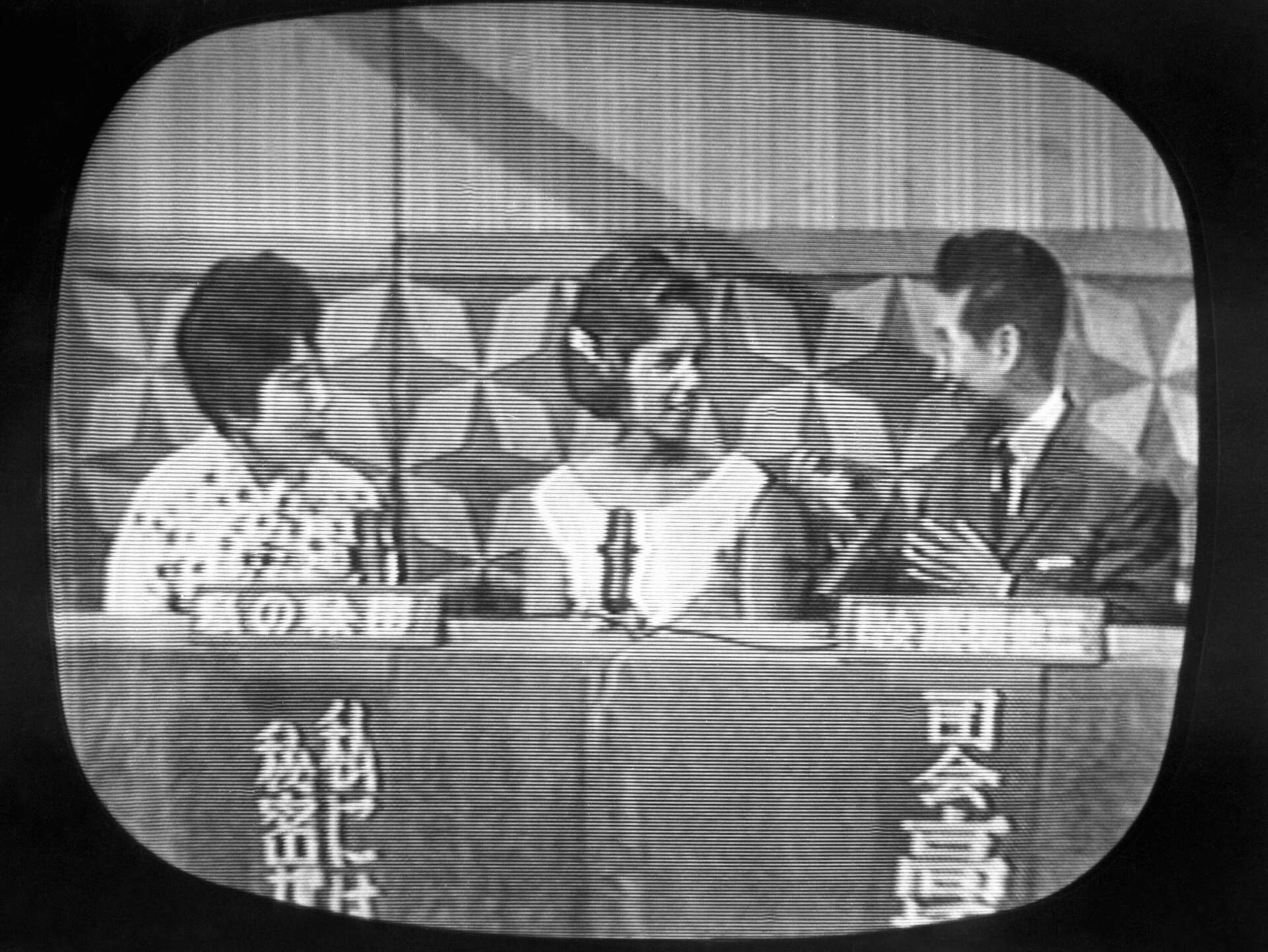 Ethel Kennedy speaks with Keizo T. Takahashi, the master of ceremonies during her appearance on the TV show in Japan on February 5, 1962 in Tokyo. J On the left is interpreter Kumiko Takeuchi. (AP photo)