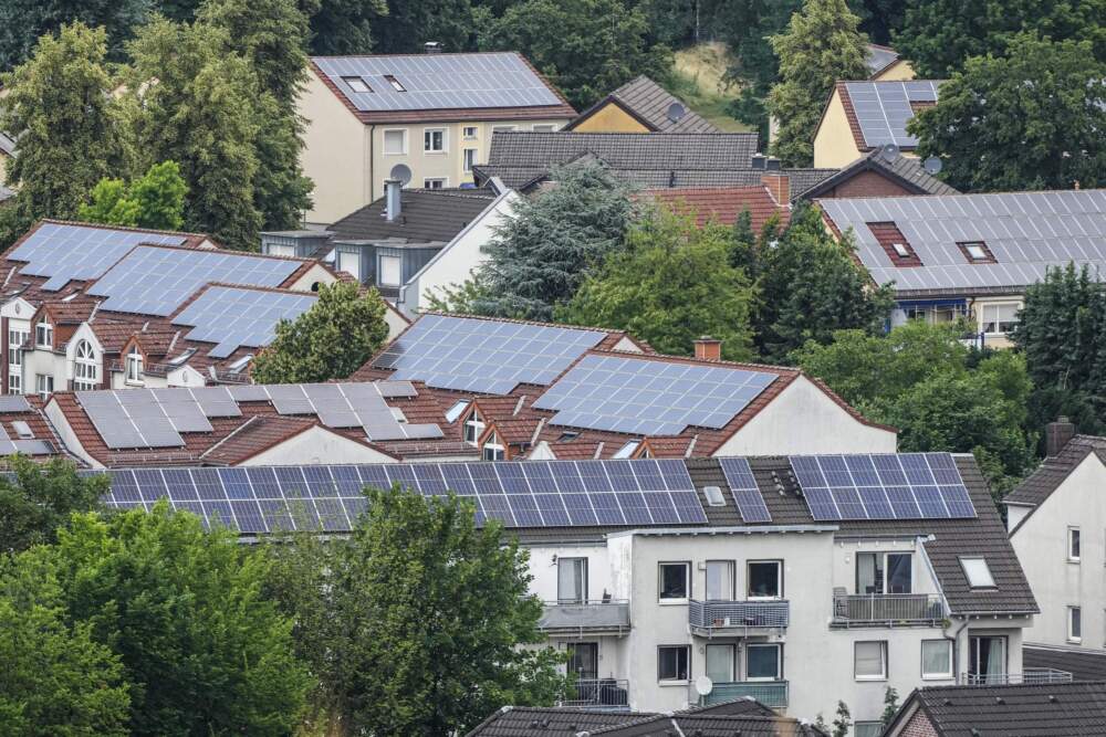 Solar panels are mounted on the roofs of apartment buildings in Bottrop, Germany. (Martin Meissner/AP)