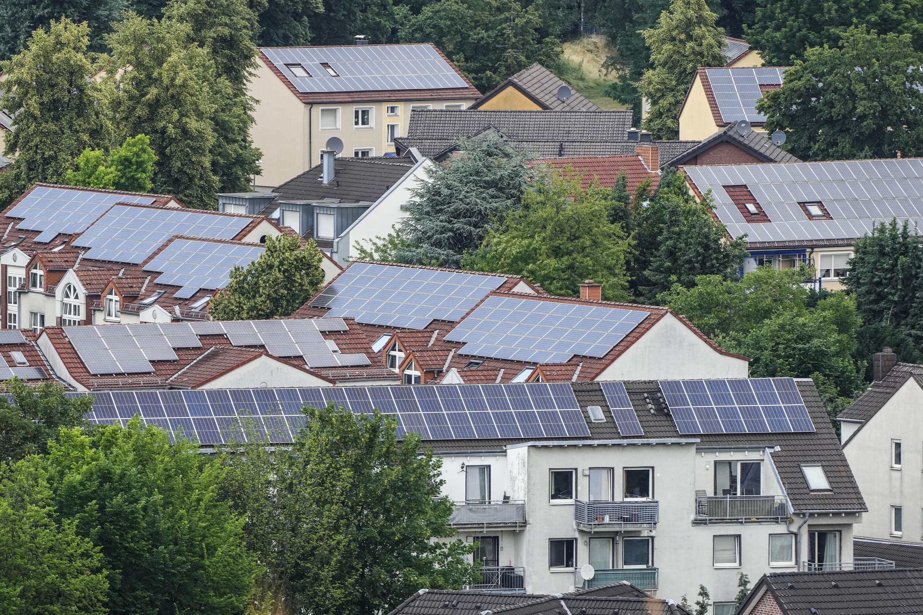 Solar panels are mounted on the roofs of apartment buildings in Bottrop, Germany. (Martin Meissner/AP)