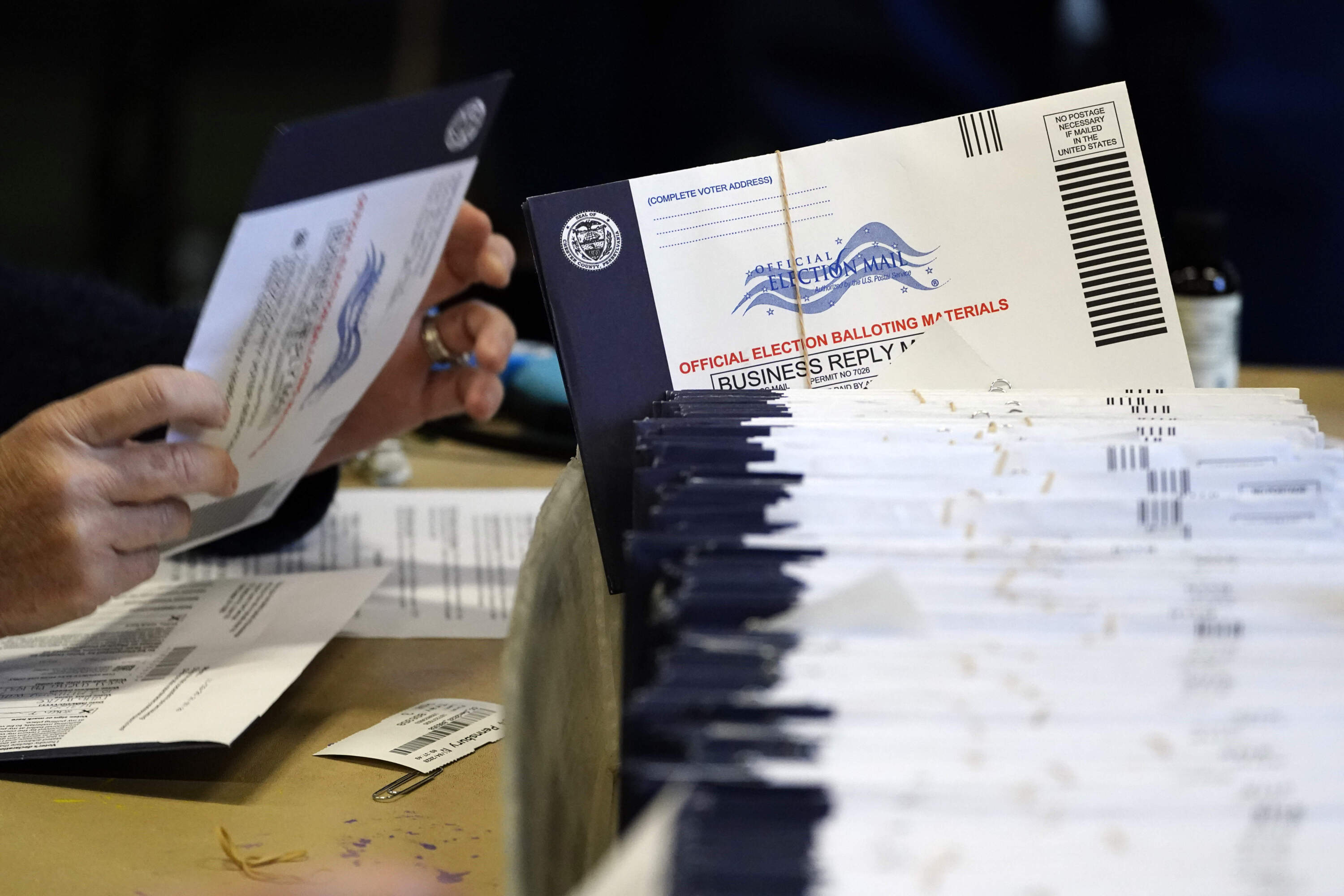 Pennsylvania election workers process mail-in and absentee ballots in 2020. (Matt Slocum/AP)