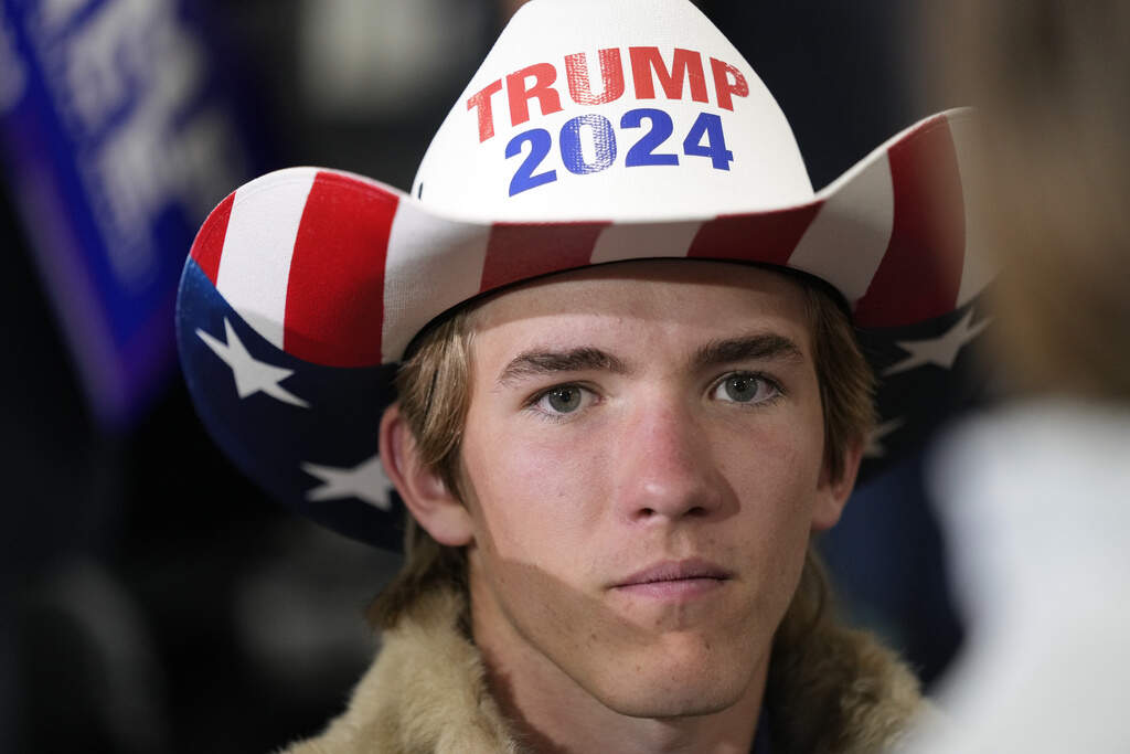 A young man at a campaign event for Republican presidential candidate former President Donald Trump at Dane Manufacturing, on Oct. 1, in Waunakee, Wis. (Charlie Neibergall/AP Photo)