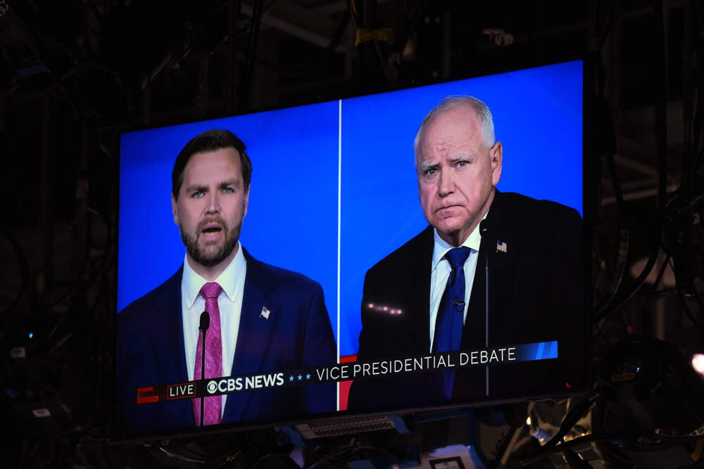 As seen on a monitor in the studio Republican vice presidential nominee Sen. JD Vance, R-Ohio, and Democratic vice presidential candidate Minnesota Gov. Tim Walz participate during a vice presidential debate hosted by CBS News, Tuesday, Oct. 1, 2024, in New York. (AP Photo/Matt Rourke)