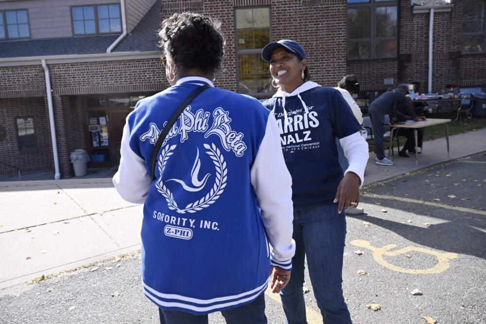 Linda Chapman of Waterbury, left, a member of Zeta Phi Beta Sorority, Inc., speaks with U.S. Rep. Jahana Hayes, D-Conn. at a Souls to the Polls voting rally at Grace Baptist Church, Oct. 26, 2024, in Waterbury. (Jessica Hill/AP)