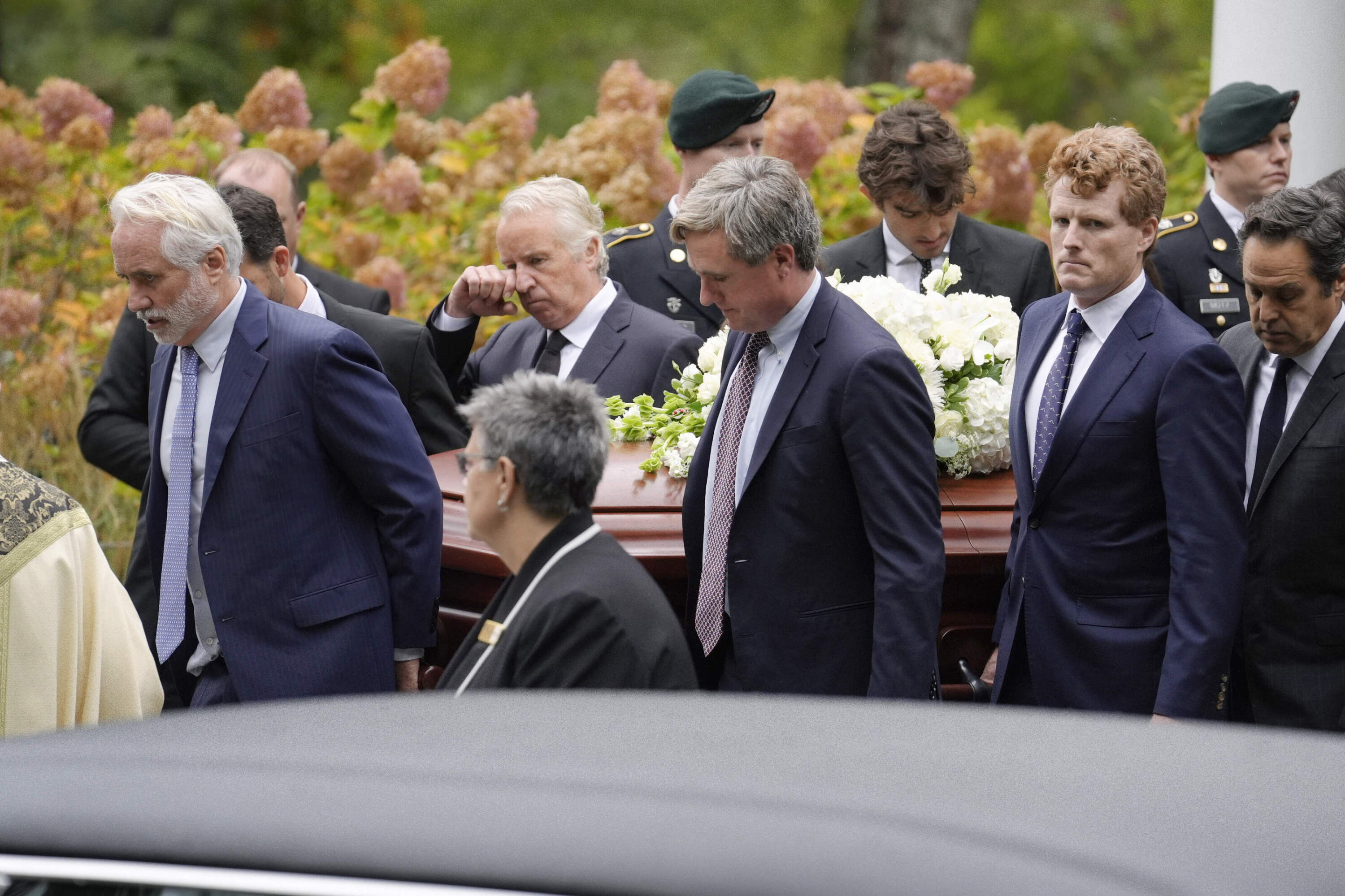 Pallbearers Max Kennedy, left, Chris Kennedy, behind center left, both sons of the late Ethel Kennedy, and Matt Kennedy, center front, and, Joseph Kennedy III, front second from right, both grandsons of Ethel Kennedy, carry her casket from Our Lady of Victory church, following funeral services, Monday, Oct. 14, 2024, in Centerville, Mass. (Steven Senne/AP)