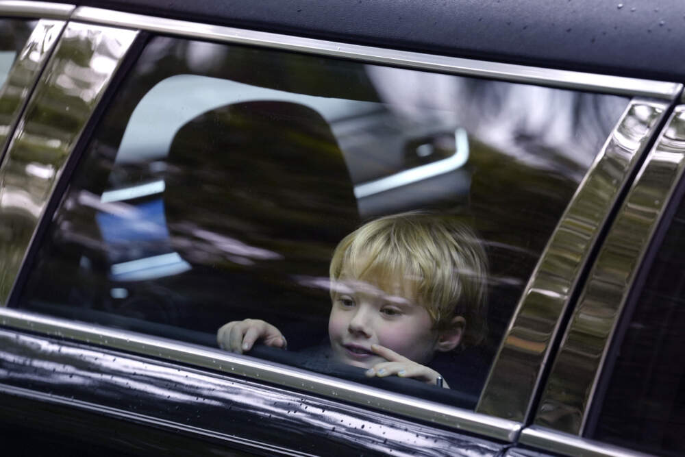 James Kennedy, great grandson of Ethel Kennedy, wife of Sen. Robert F. Kennedy, is seated in a vehicle that forms part of a funeral procession departing Our Lady of Victory church. (Steven Senne/AP)